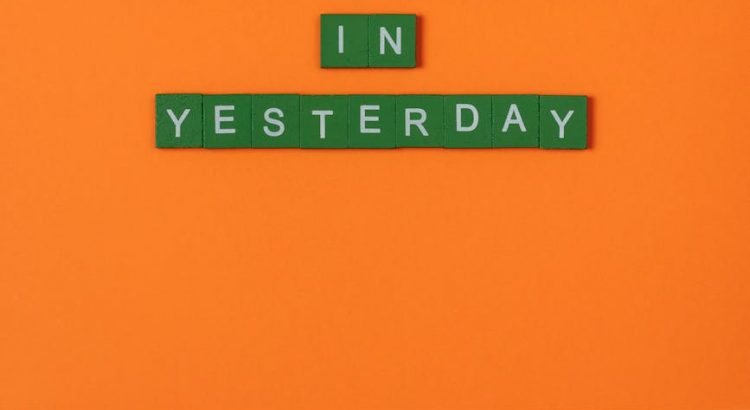 green letter tiles on an orange surface